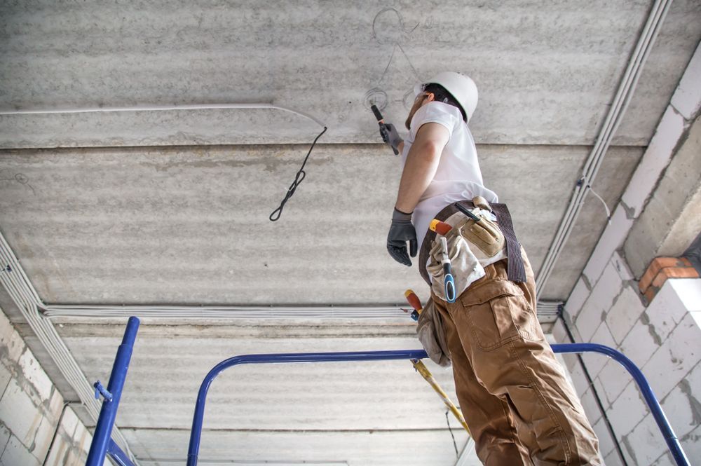 Cairns Excel Electrics technician working on a ceiling installation in Far North Queensland